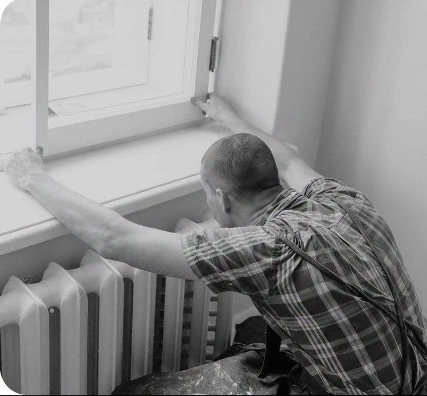 Man fitting windows