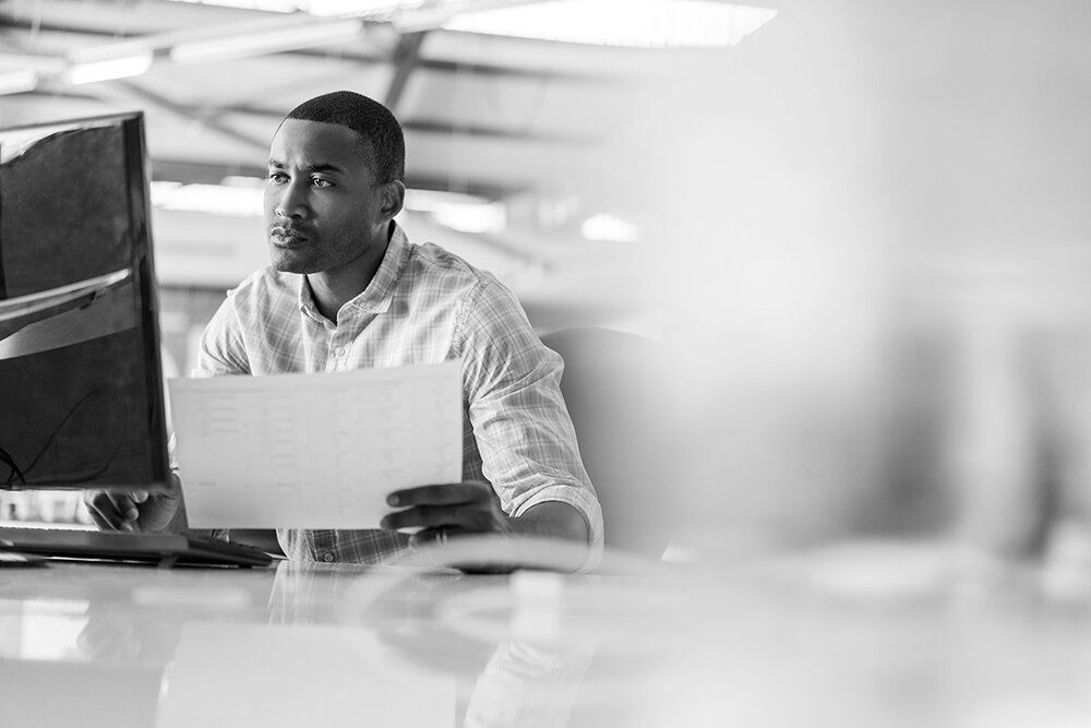 Man at desk on computer