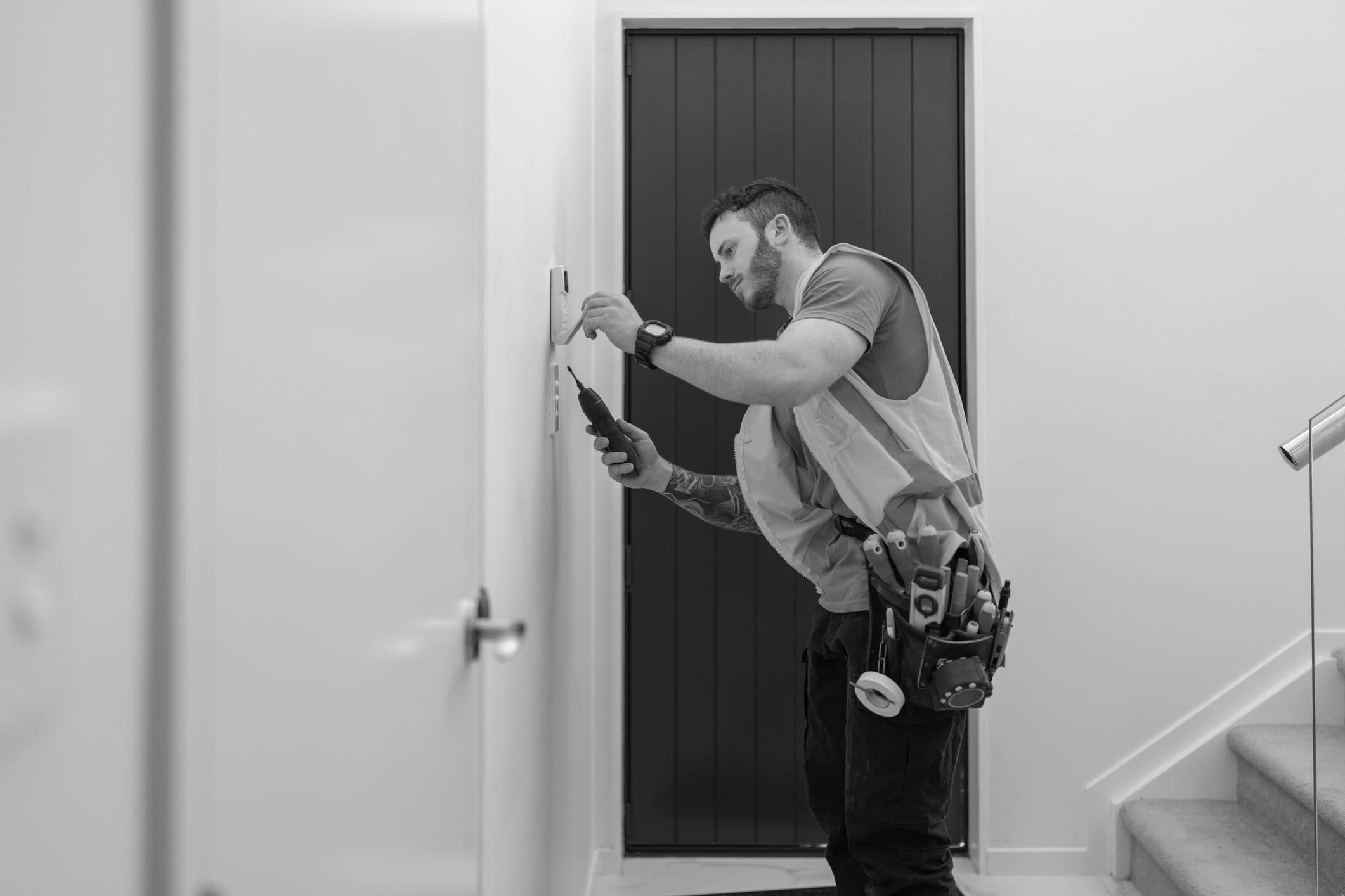 Man fixing thermostat